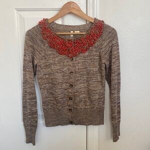 Moth Anthropologie brown cardigan with bright beaded embellishments.